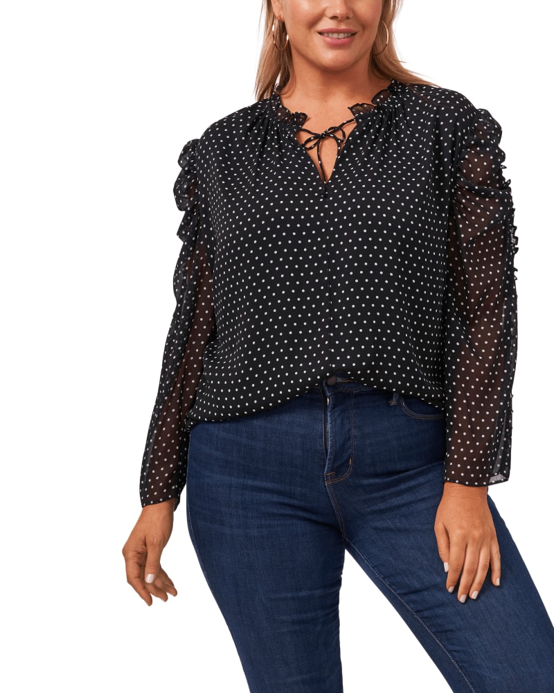 Front of a model wearing a size 1X Valeria Polka Dot Ruffle Blouse in 060-RICH BLACK by CeCe. | dia_product_style_image_id:263596